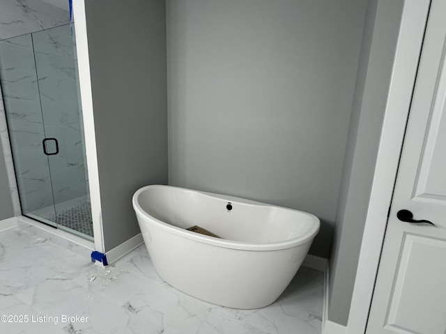 bathroom with separate shower and tub