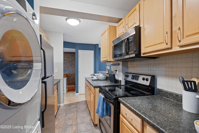 kitchen with washer / clothes dryer, backsplash, light tile patterned floors, stainless steel appliances, and light brown cabinets