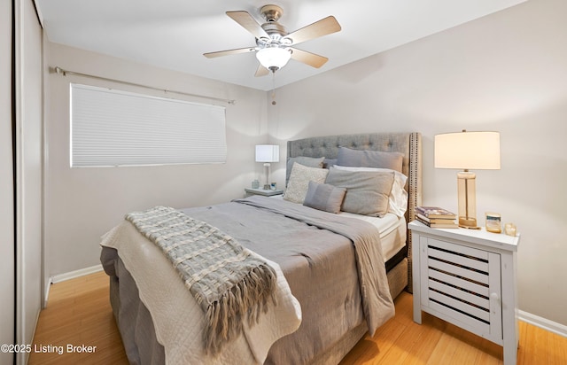 bedroom featuring ceiling fan and light hardwood / wood-style flooring