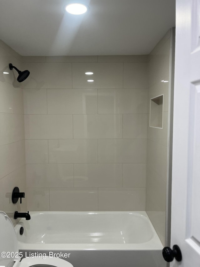 full bathroom featuring bathing tub / shower combination and toilet