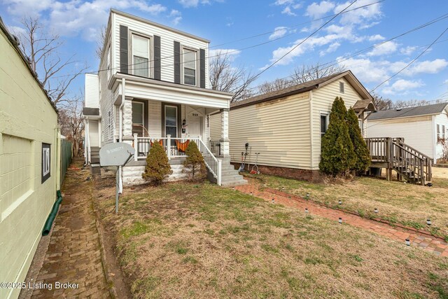 view of front of home featuring a front lawn and a porch