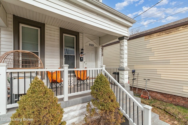 doorway to property featuring a porch