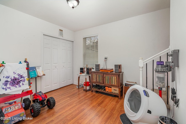 recreation room featuring wood finished floors