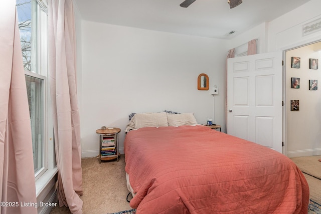 bedroom with visible vents, carpet floors, a ceiling fan, and baseboards