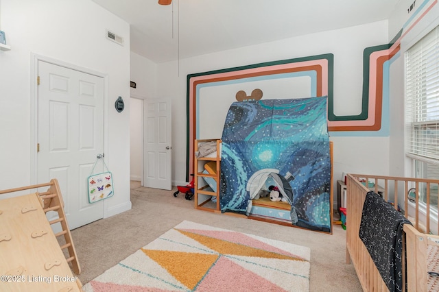 recreation room with carpet floors, visible vents, and baseboards