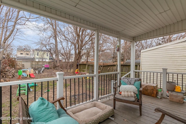 wooden deck featuring a fenced backyard