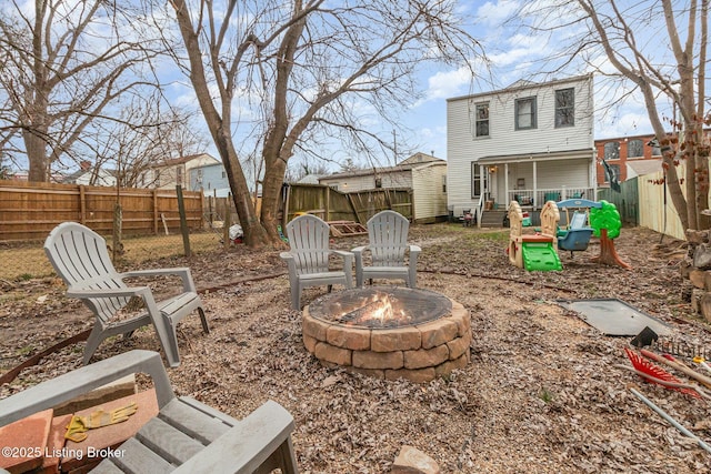 view of yard with an outdoor fire pit and a fenced backyard