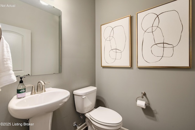 bathroom with toilet and sink