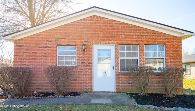 view of front of house with brick siding