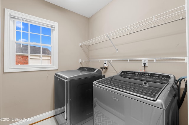 laundry area featuring laundry area, independent washer and dryer, and baseboards