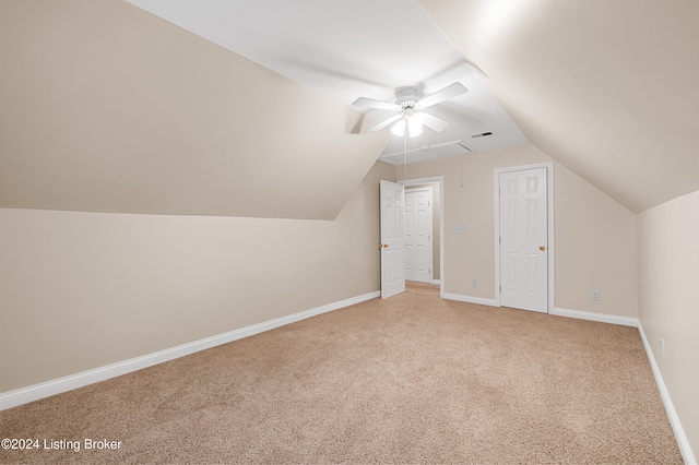 additional living space with ceiling fan, baseboards, vaulted ceiling, and carpet flooring