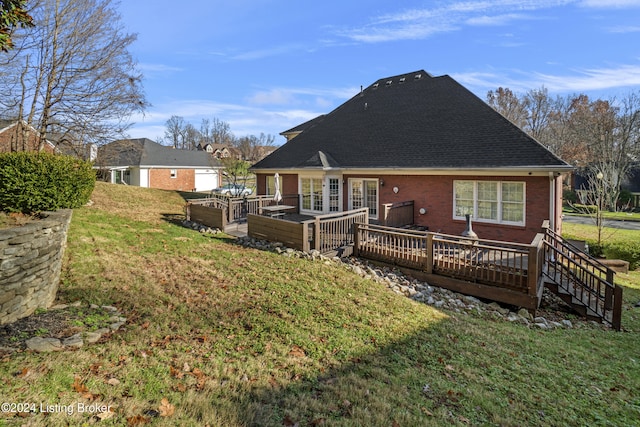 rear view of property with a wooden deck, an outdoor hangout area, a yard, a patio area, and brick siding