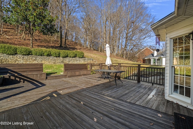 wooden terrace featuring outdoor dining space