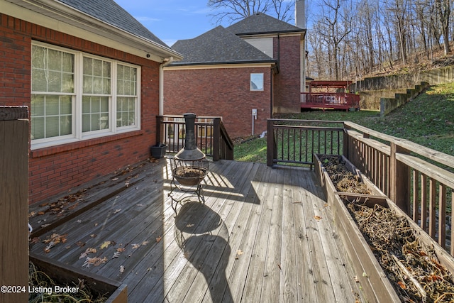 deck featuring an outdoor fire pit