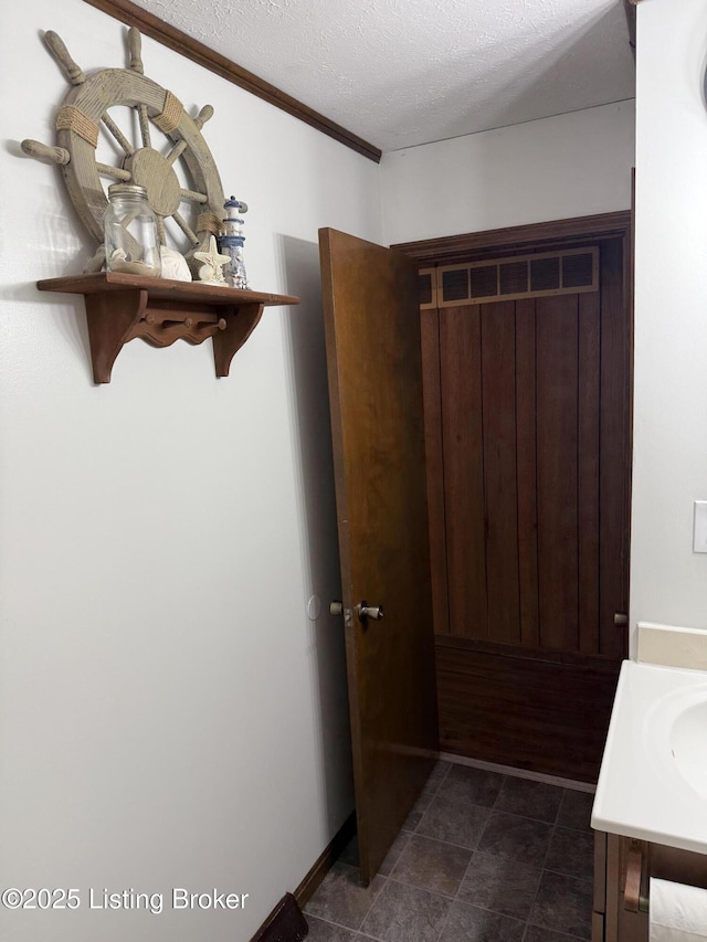 bathroom featuring vanity and a textured ceiling