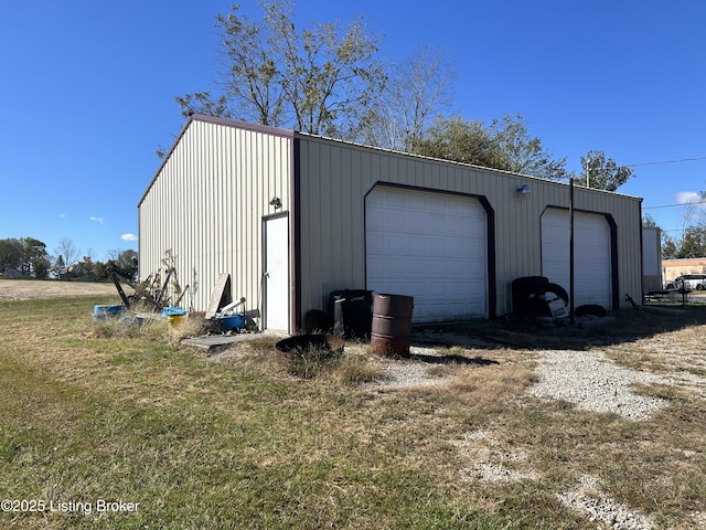 garage with a yard