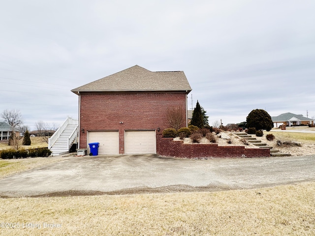 view of side of home with a garage