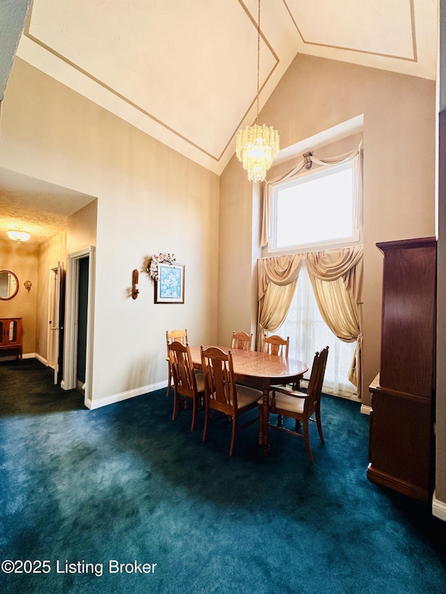 carpeted dining room with high vaulted ceiling and a notable chandelier