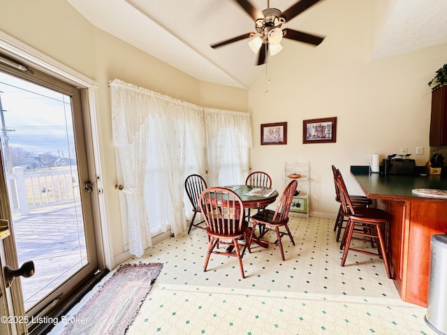 dining room with lofted ceiling and ceiling fan