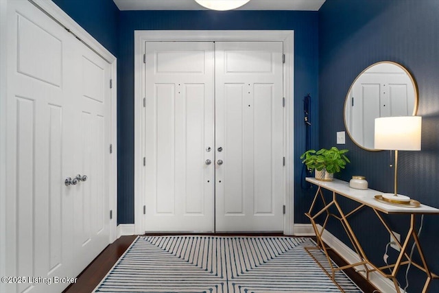 foyer entrance featuring dark hardwood / wood-style floors