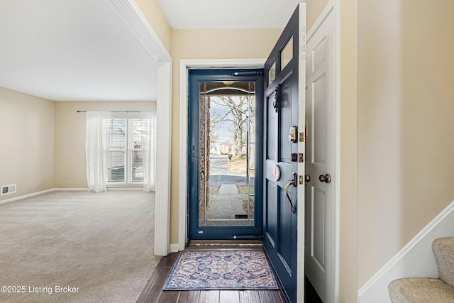 interior space with dark colored carpet