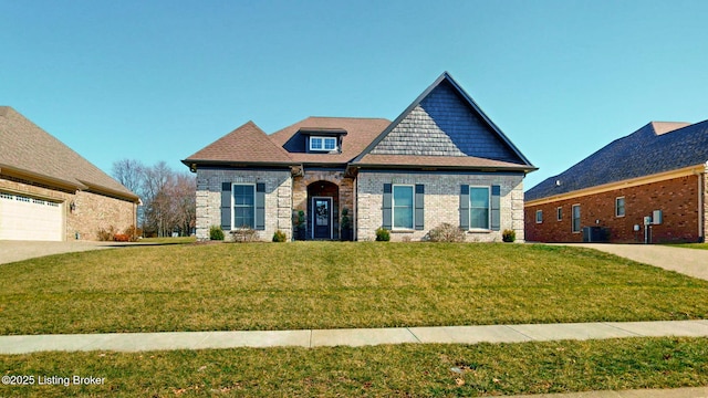 craftsman-style house featuring a garage, brick siding, and a front lawn