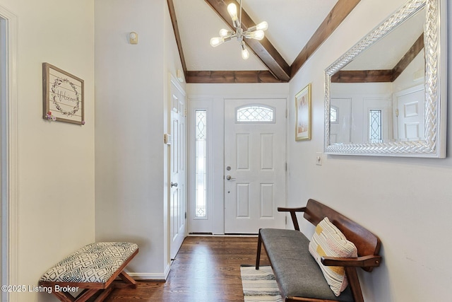 entryway featuring a chandelier, vaulted ceiling with beams, dark hardwood / wood-style flooring, and a healthy amount of sunlight