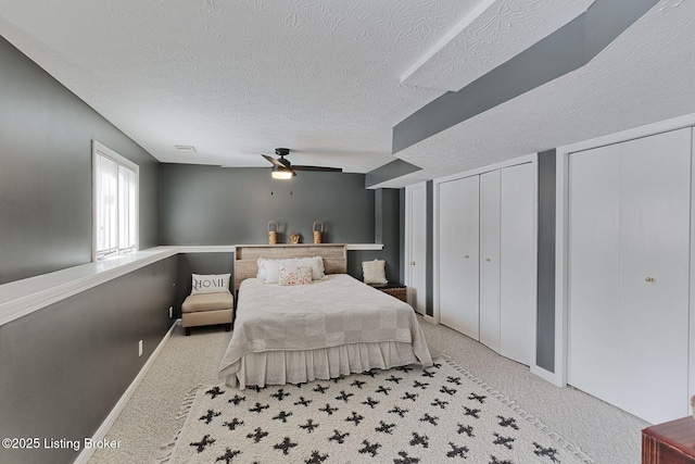 13200 Creekview Rd, Prospect, KY 40059 - bedroom with carpet flooring, a textured ceiling, multiple closets, and a ceiling fan