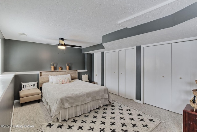 13200 Creekview Rd, Prospect, KY 40059 - bedroom with visible vents, a ceiling fan, two closets, and a textured ceiling