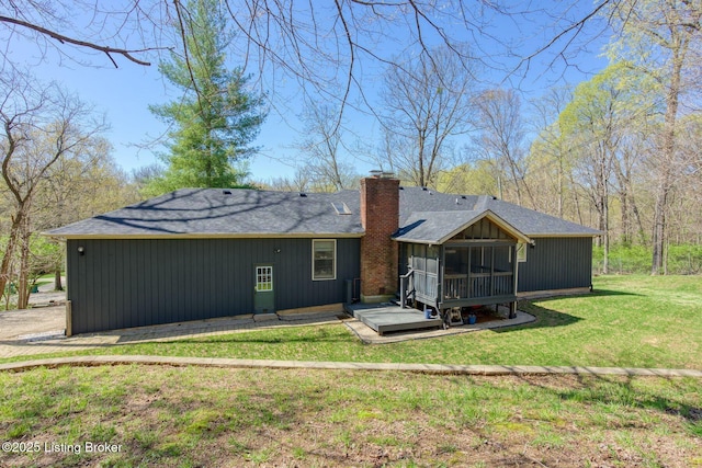 13200 Creekview Rd, Prospect, KY 40059 - rear view of property with a sunroom, a lawn, a chimney, a shingled roof, and central AC unit