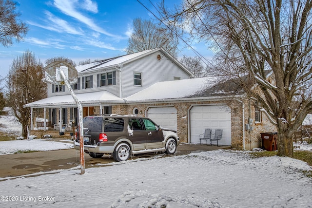 view of front of house with covered porch and a garage