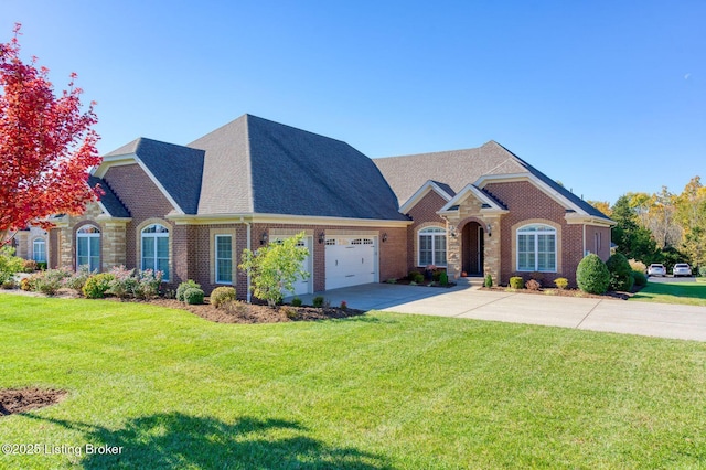 view of front facade with a garage and a front yard