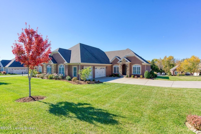 view of front of home featuring a front yard and a garage