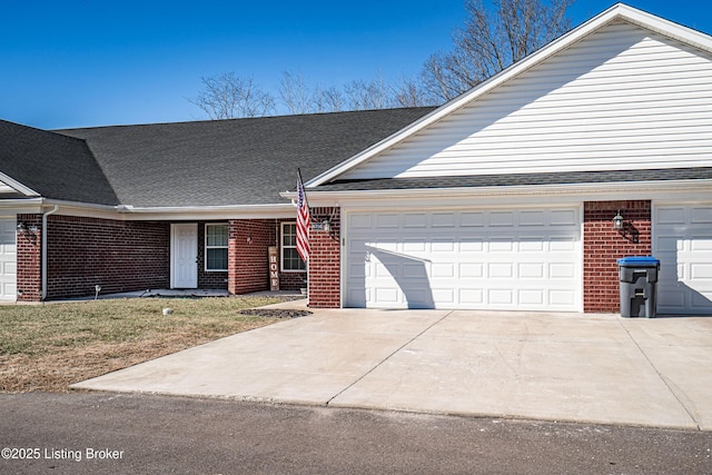 ranch-style home with a garage and a front lawn