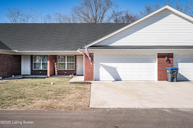 single story home with a garage and a front lawn