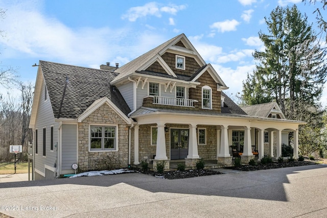 view of front of home featuring a porch and a chimney