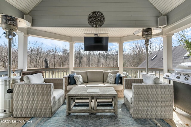 view of patio / terrace with outdoor lounge area and a gazebo