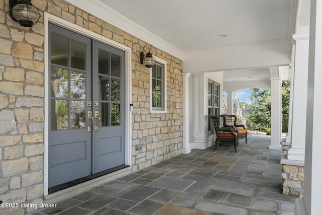 view of patio featuring french doors and covered porch