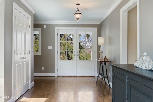 entryway with dark wood-type flooring, french doors, crown molding, and baseboards