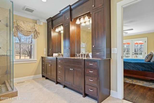 bathroom featuring french doors, a stall shower, ensuite bath, and visible vents