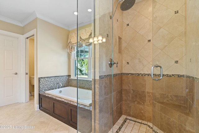 full bathroom with a garden tub, toilet, ornamental molding, a stall shower, and tile patterned flooring