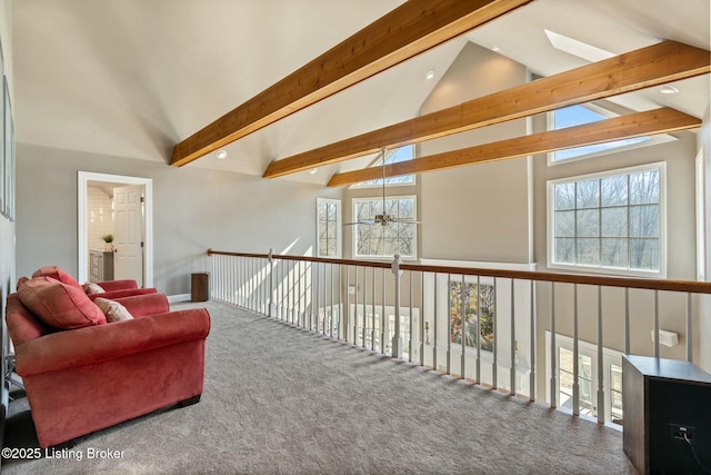 living area featuring high vaulted ceiling, beam ceiling, and carpet flooring