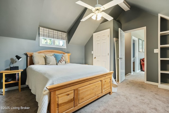 bedroom with light carpet, baseboards, vaulted ceiling, and a ceiling fan