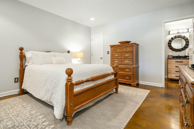 bedroom featuring recessed lighting, concrete floors, and baseboards