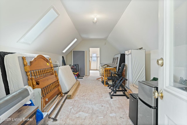 additional living space featuring vaulted ceiling with skylight