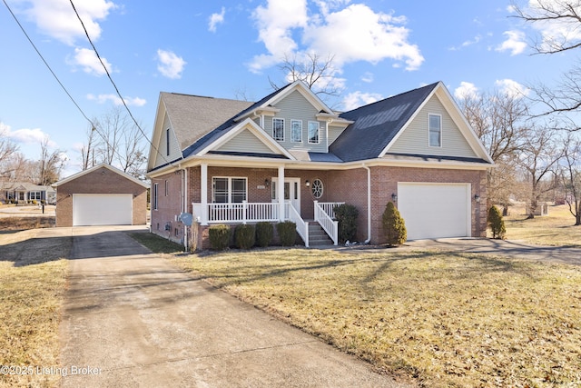 view of front of home with a garage, a front yard, and a porch