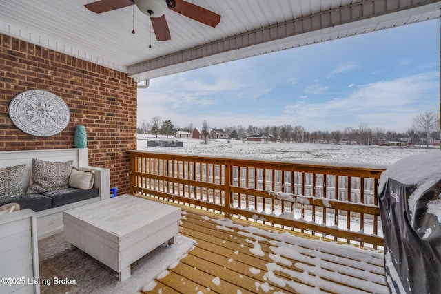 snow covered deck with ceiling fan