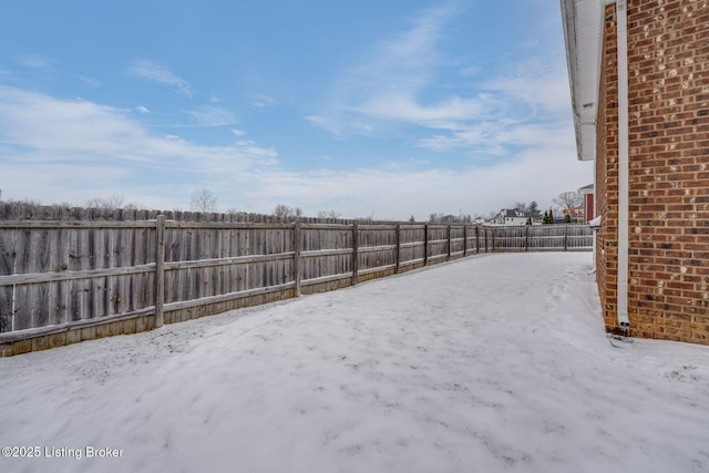 view of yard covered in snow