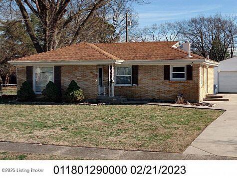 single story home featuring a garage and a front yard