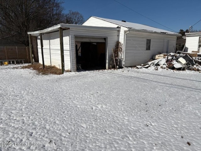 view of snow covered garage